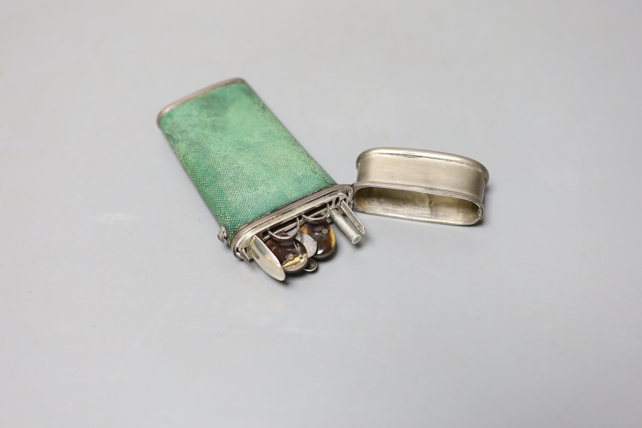 An 18th century white metal and shagreen mounted etui with steel, white metal and tortoiseshell implements, 90mm.